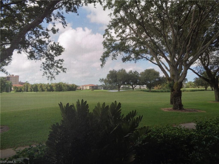 View of home's community with a lawn
