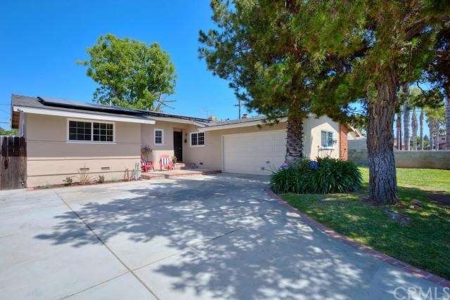 Newer driveway, newer garage door, solar panels wi
