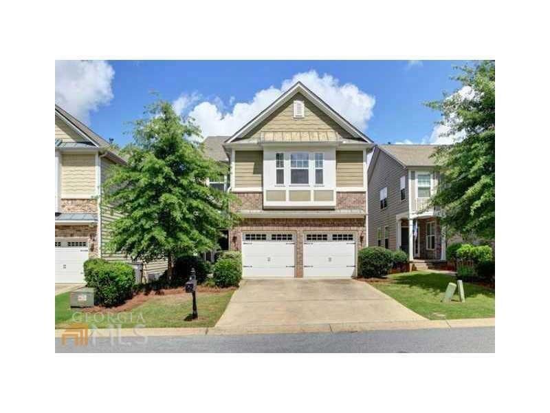 Craftsman house with a garage, concrete driveway, and a front yard