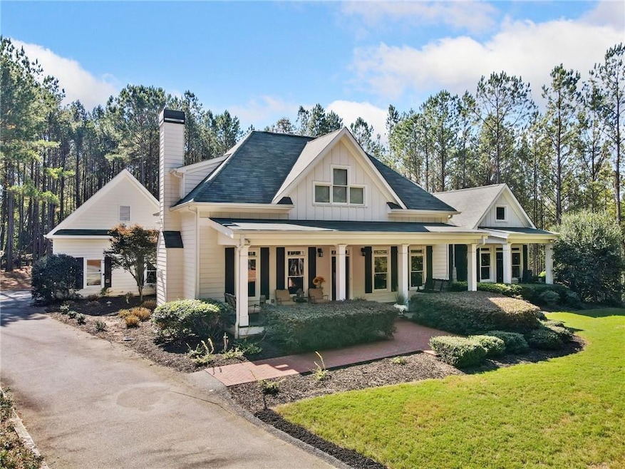 View of front of home featuring a front yard, cove