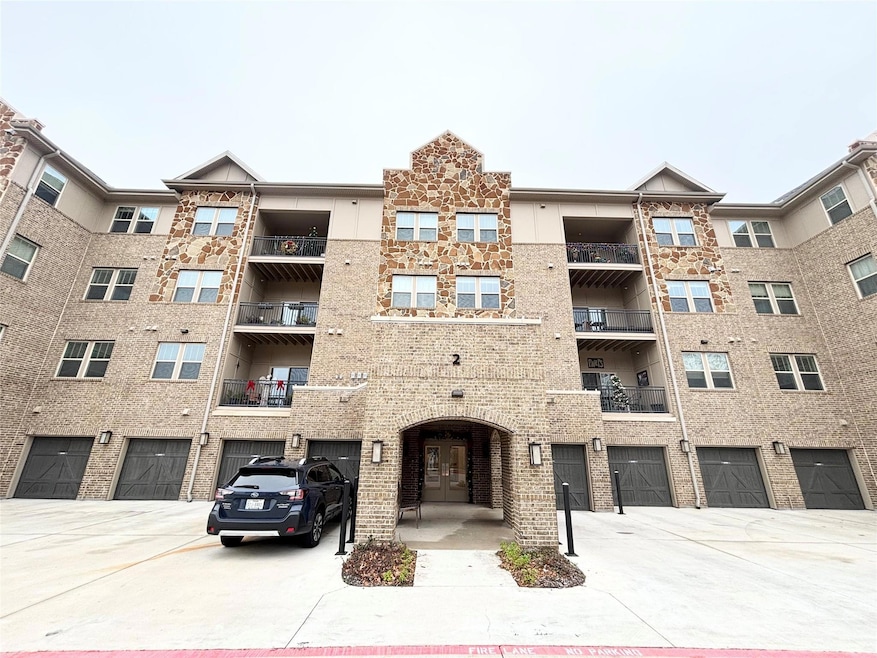 View of building exterior with an attached garage 