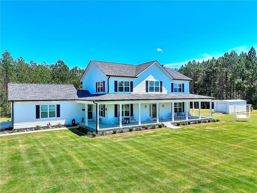 Farmhouse-style home with wrap around front porch,