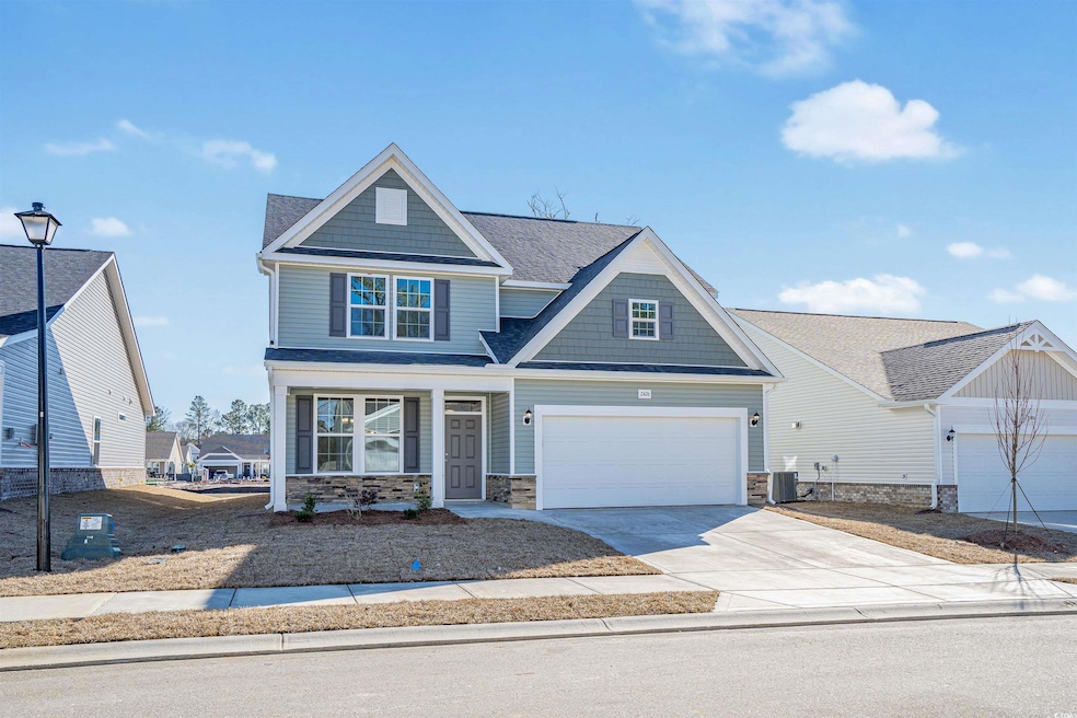 Craftsman-style house with a garage, central AC, a