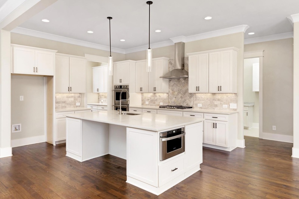 Kitchen w quartz countertops. 
