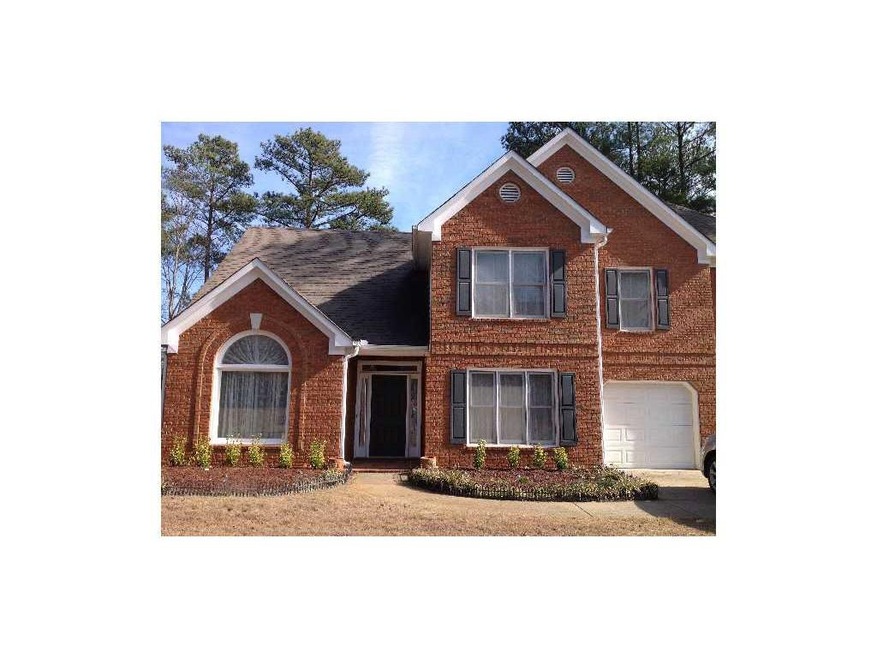 Exterior Front. Flat level lot with 2 car garage