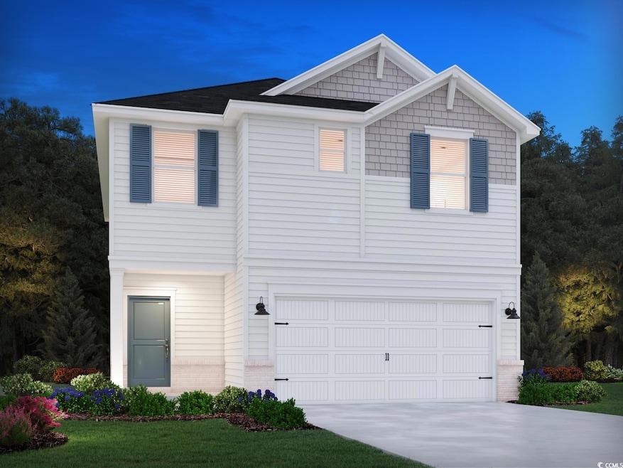 View of front of house with driveway and a garage