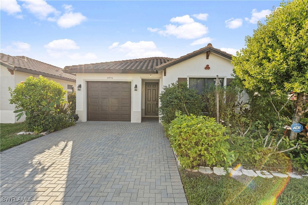 8976 Madrid Cir, Naples, FL 34104 - photo 1