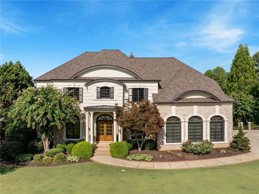 French country style house with a front yard