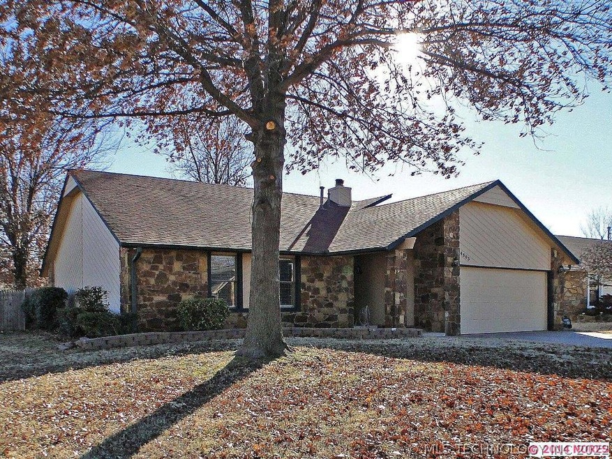 Corner lot with mature trees and full fence.