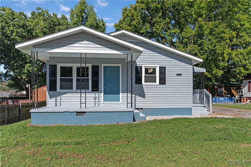 Bungalow-style house featuring covered porch and a