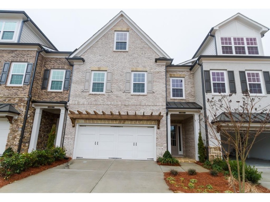 Homesite 62 is interior brick unit with a covered 