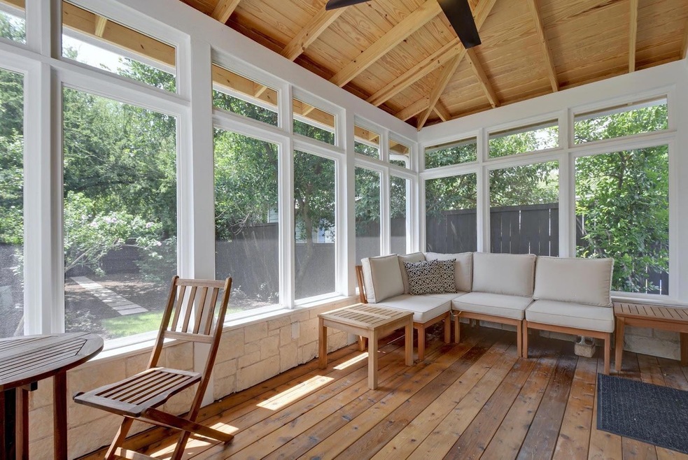 Sunroom with wooden ceiling and lofted ceiling wi