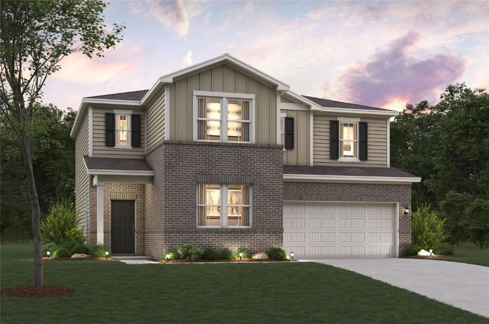 Traditional-style home featuring brick siding, a garage, concrete driveway, and board and batten siding