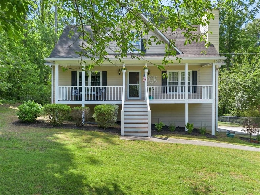 View of front of house with a porch, stairs, and a