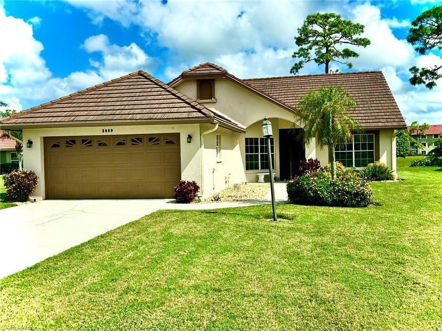 View of front of property with a front yard and a 