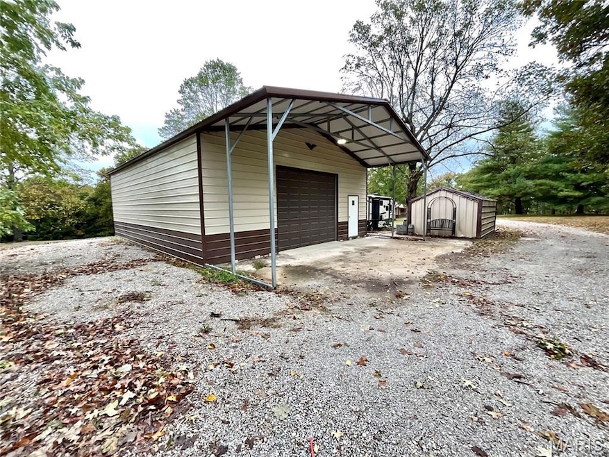 View of shed with driveway