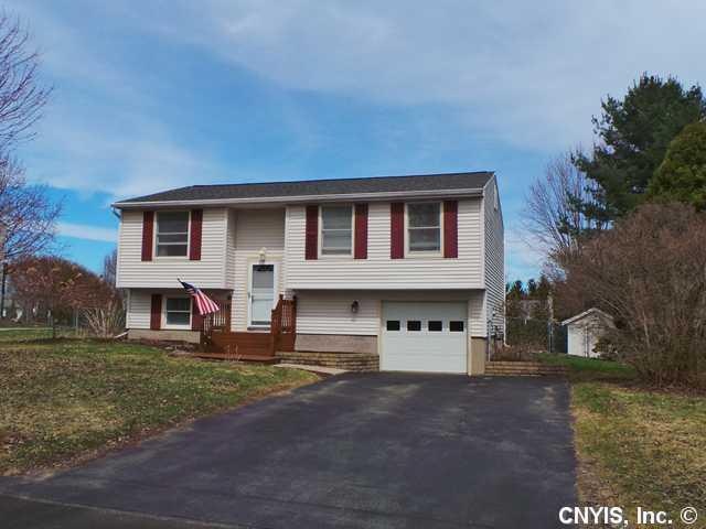 Exterior Front. Nicely landscaped with retaining wall, double paved driveway and fully fenced private yard.