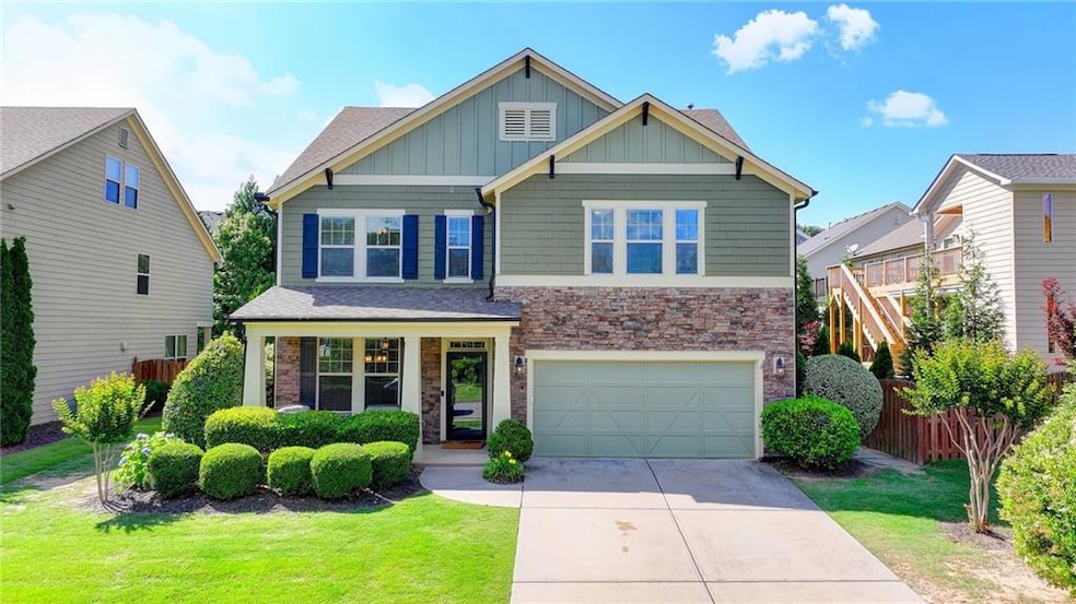 Craftsman-style home with a garage and a front yar
