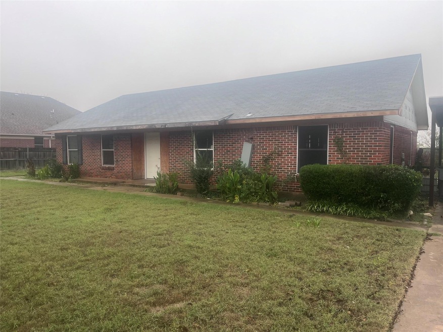 Ranch-style home with a front lawn