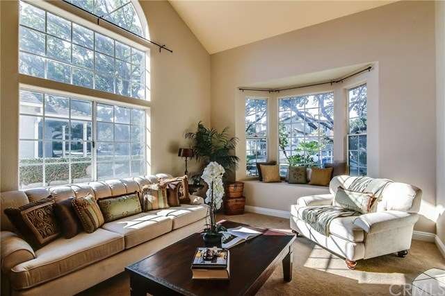 Spacious  living room with soaring ceilings and dr