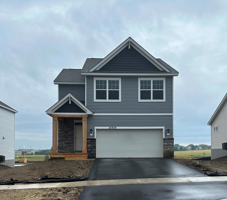 The Pine floorplan on a lookout basement with a sidewalk right in front of the house!  Photo is of the actual home.  *Sod and irrigation will go in soon.