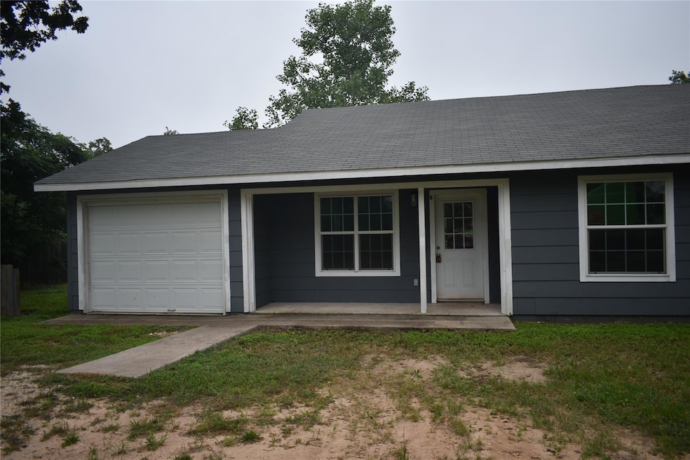 View of front of home featuring a garage