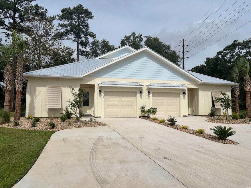 Ranch-style home featuring a garage
