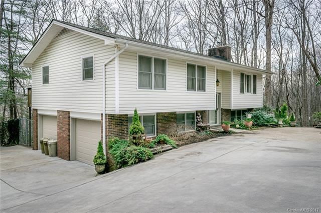 Front of home with parking areas