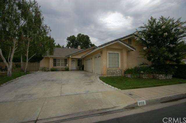 Front of home, note large cement driveway