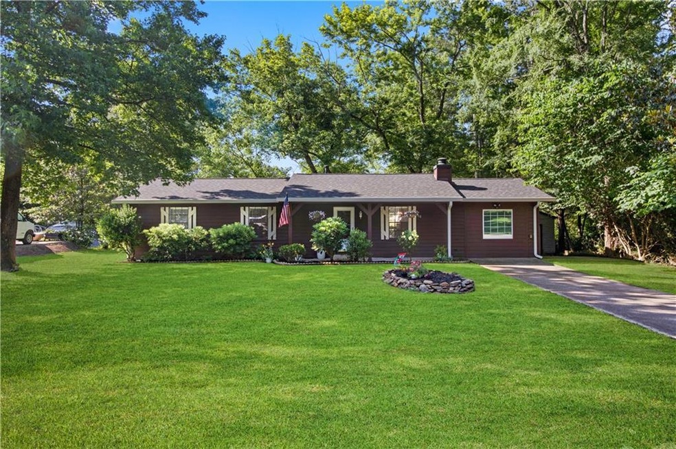 Ranch-style house featuring a front yard