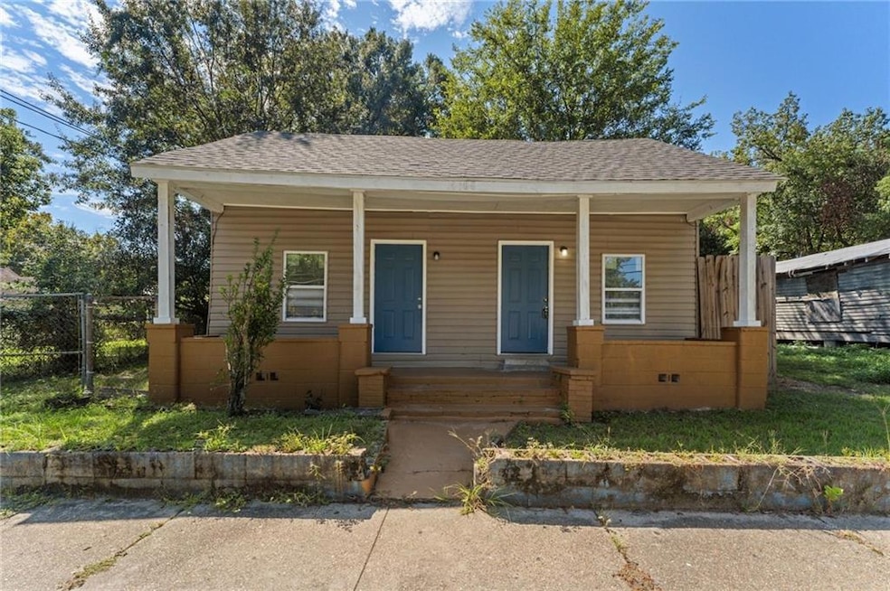 Bungalow-style house with covered porch and a shingled roof