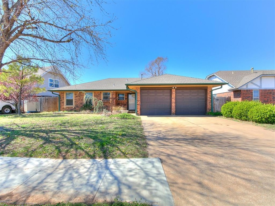 View of front facade with brick siding, driveway, 