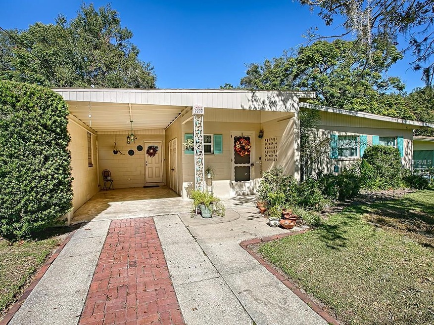 Concrete block construction with newer windows.