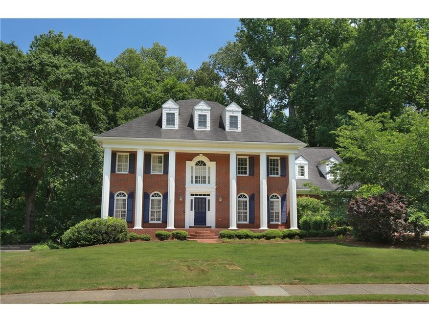 This grand 4 sided red brick traditional boasts a 