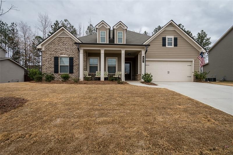 Exterior Front on level lot with long driveway