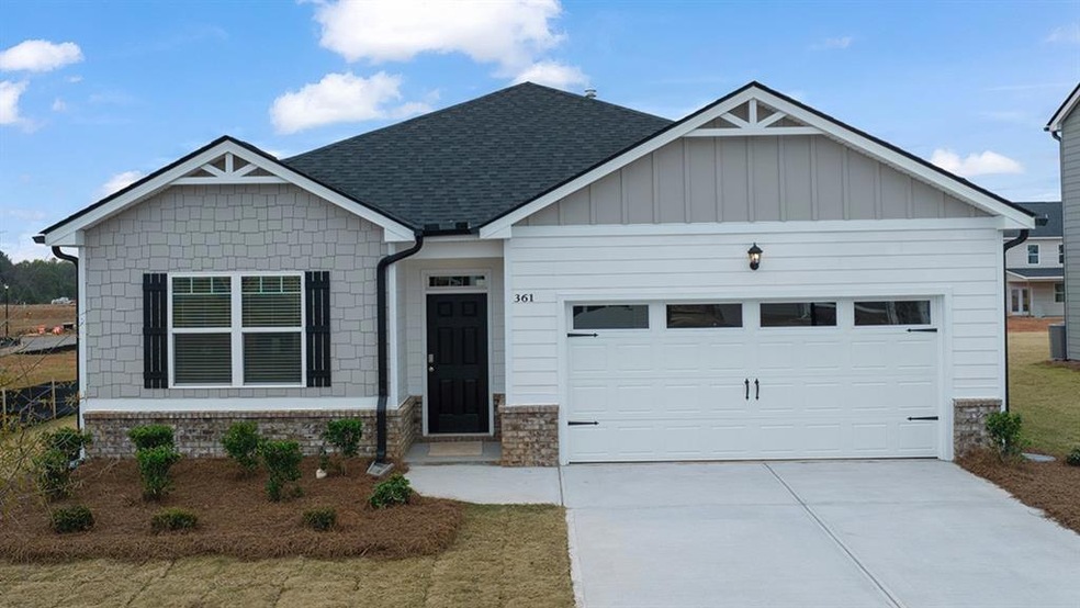 View of front of property featuring a garage
