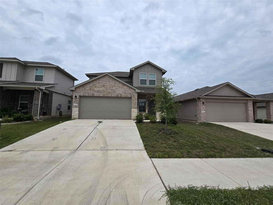 View of front of house featuring concrete drivewa