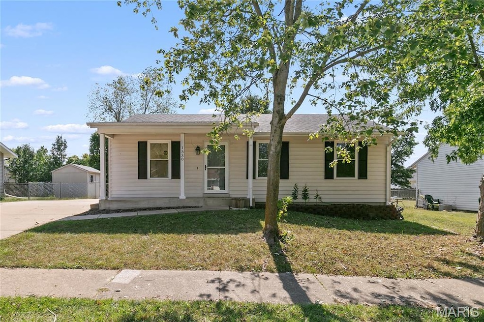 View of front of property with covered porch and roof with shingles