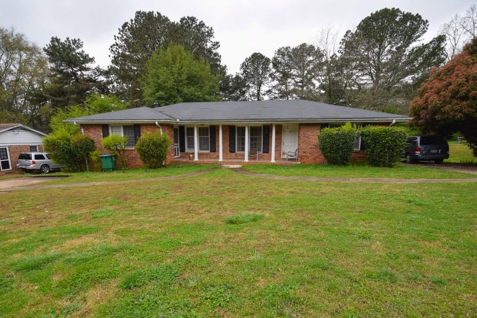 Cute and cozy duplex property sits on half an acre