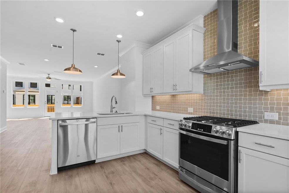 The open kitchen, family room, and dining area cre