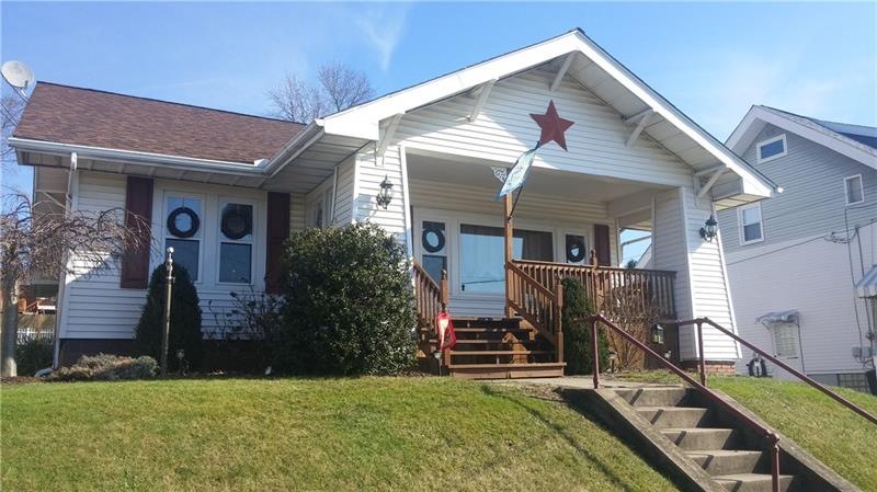 FRONT HAS LOVELY COVERED PORCH