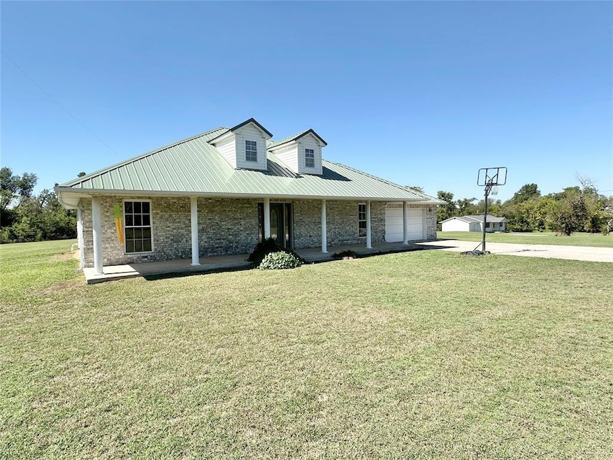 View of front of home featuring a garage, a front 