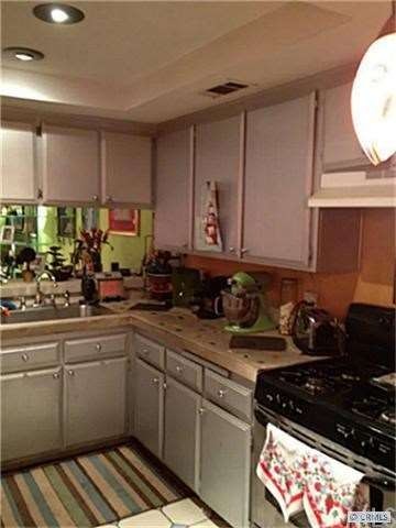Gourmet Kitchen With Recessed Halogen Lighting
