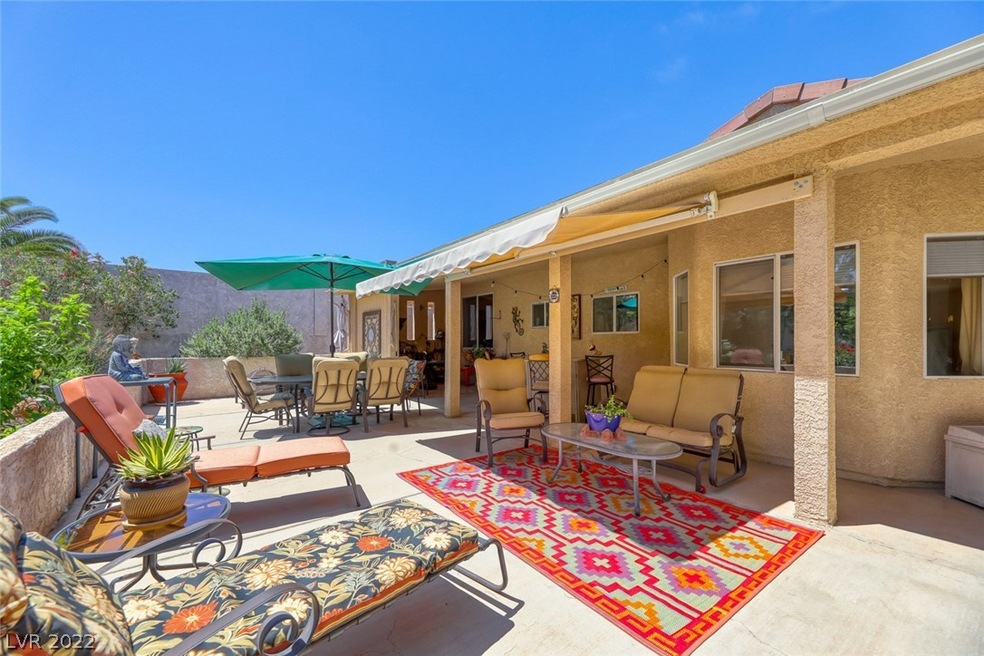 Covered patio with awning and resort-like backyard!