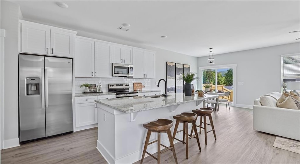 Kitchen with appliances with stainless steel finis