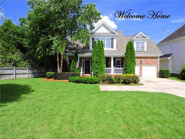 Lovely custom home on level lot set back from stre