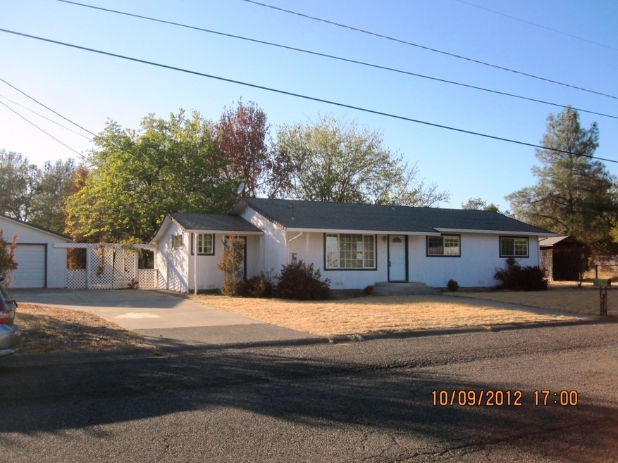 front with garage & shed