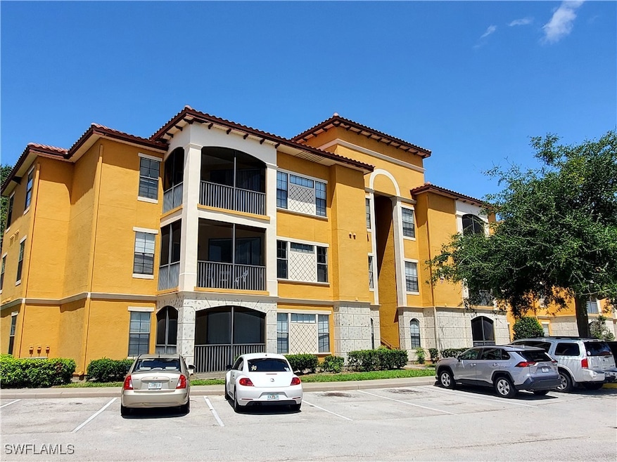 View of property with uncovered parking