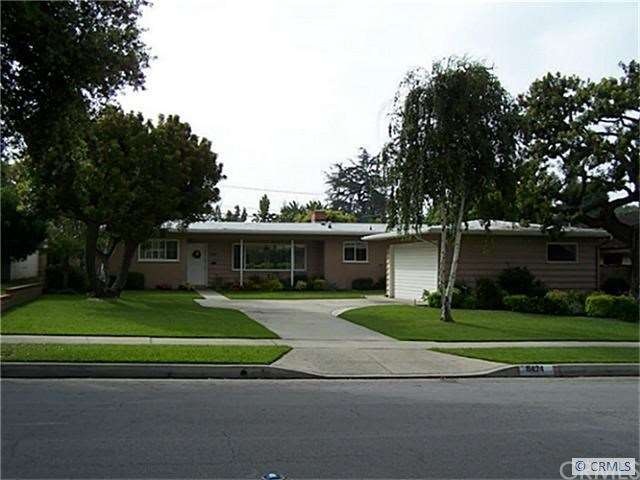 front of home; cement driveway leading to entrance