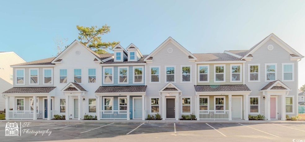 Multi unit property featuring uncovered parking and a porch